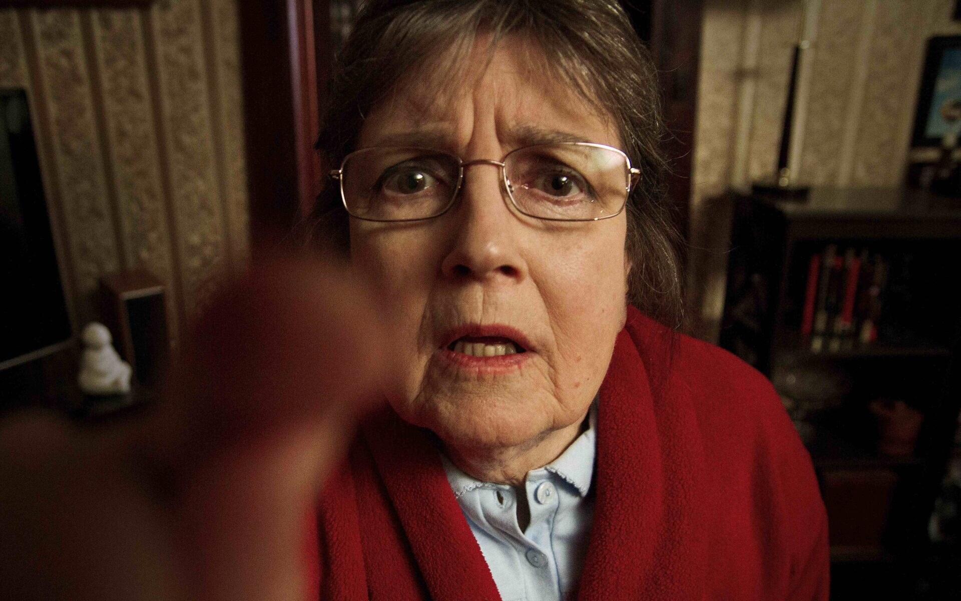 Doris reaches towards the camera